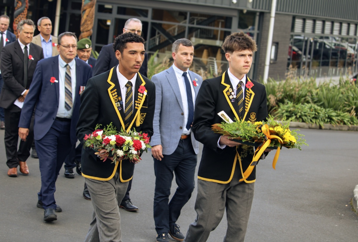 Harper laying a wreath at the ANZAC service